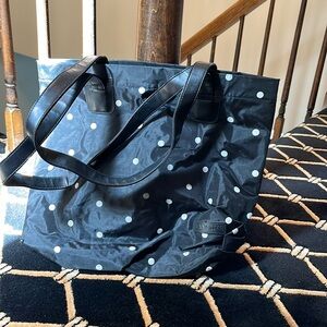 Lancôme versatile carry bag with snap and zipper compartments